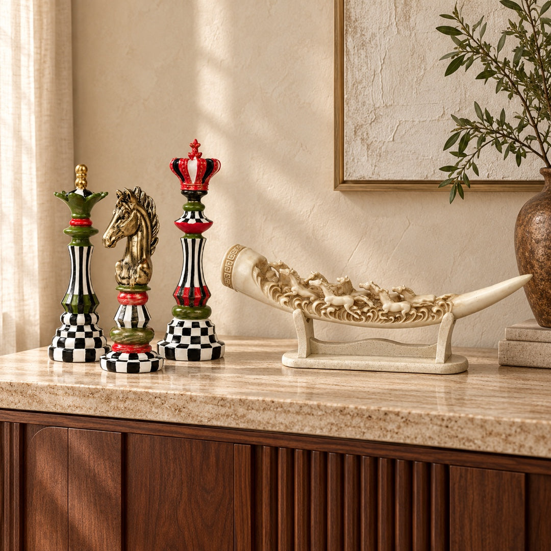 Decorative chess pieces and running horses sculpture on a walnut console