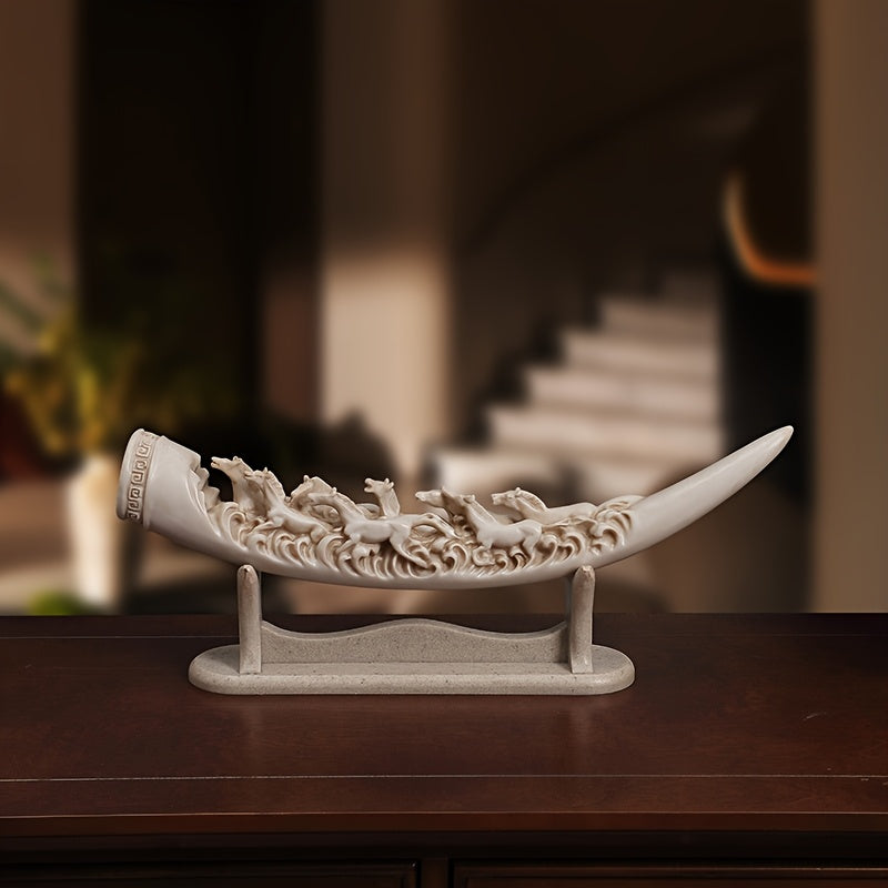 Supplier photograph of the off-white running horses sculpture on its matching stand, front display view.