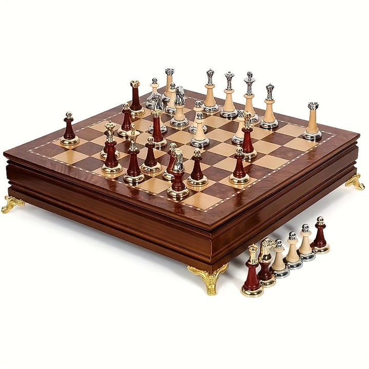 Burgundy and ivory chess set with gold-tone feet on a brown wooden board, supplier product photograph