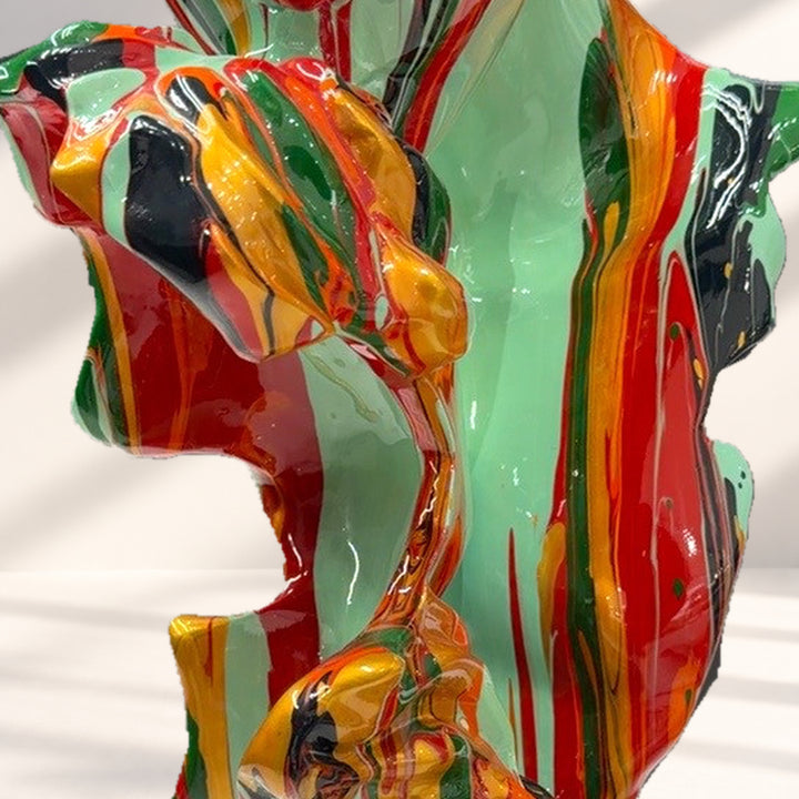 Detail of glossy multicolour forms against a styled studio background