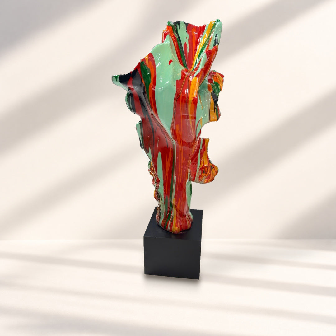 Complementary rear angle of the multicolour sculpture against a styled studio background