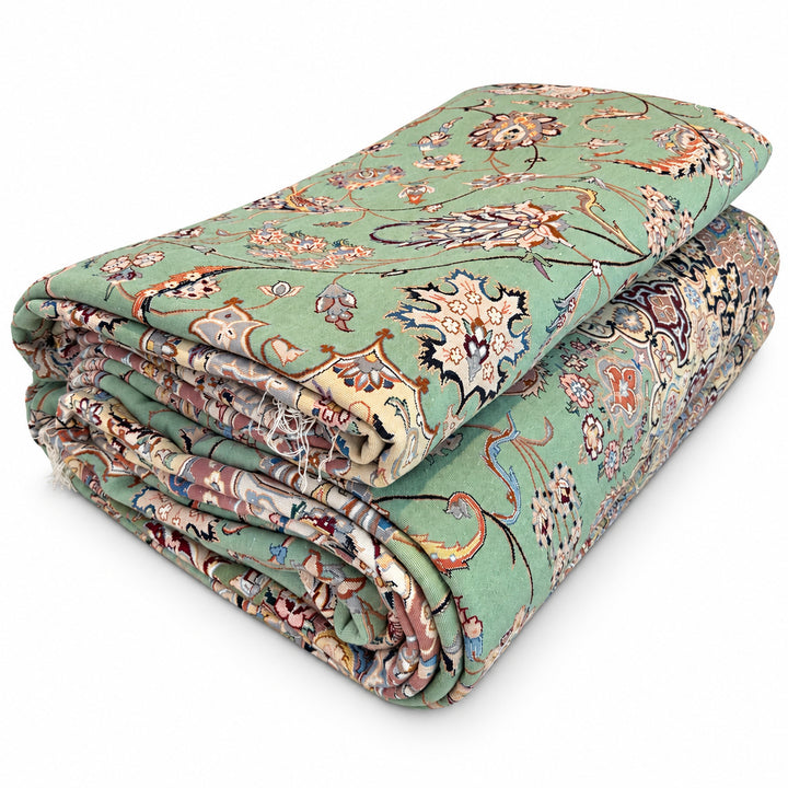 Medallion Shah Abbasi rug - folded view on white background